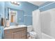 Cozy bathroom features a stylish vanity, bright lighting, and a shower-tub combination at 2740 Braxton Dr, Indianapolis, IN 46229
