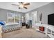Bedroom featuring a cozy bed, natural light, neutral carpet and two closets at 2740 Braxton Dr, Indianapolis, IN 46229