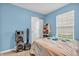 Comfortable bedroom with wood floors and a window providing natural light at 2740 Braxton Dr, Indianapolis, IN 46229