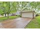 Charming home with a two-car garage and well-maintained lawn and landscaping in a quiet community at 2740 Braxton Dr, Indianapolis, IN 46229