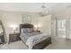 Inviting bedroom with plush bedding, natural light, and attached bathroom at 2802 Singletree Dr, Indianapolis, IN 46234