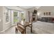 Cozy dining area with a view of the backyard and seamless flow into the adjacent living room at 2802 Singletree Dr, Indianapolis, IN 46234