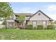 Beautiful two-story home with a well-manicured lawn and tasteful landscaping adding to its curb appeal at 2802 Singletree Dr, Indianapolis, IN 46234