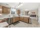 Functional kitchen featuring oak cabinetry, stainless steel appliances, and an open layout at 2802 Singletree Dr, Indianapolis, IN 46234