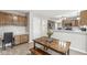 Eat-in kitchen featuring a dining table with bench seating, and built-in desk area at 2802 Singletree Dr, Indianapolis, IN 46234