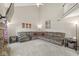 Spacious living room with a large sectional sofa, high ceilings, and natural light at 2802 Singletree Dr, Indianapolis, IN 46234