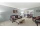 Comfortable living room with neutral tones, plush seating, and open access to the dining area at 2802 Singletree Dr, Indianapolis, IN 46234