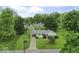 Aerial view of a home with a large, private yard surrounded by mature trees at 2840 W 12Th St, Anderson, IN 46011