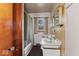 Bathroom featuring a shower-tub combo and vanity with mirrored medicine cabinet at 2840 W 12Th St, Anderson, IN 46011