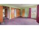 Bedroom with green walls, carpeted floors, and wood trim and doors at 2840 W 12Th St, Anderson, IN 46011