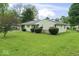 Attractive single-story home with a spacious front yard and mature trees at 2840 W 12Th St, Anderson, IN 46011