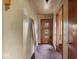 Hallway with wooden doors and vintage light fixtures at 2840 W 12Th St, Anderson, IN 46011