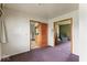 View from a living room showcasing access to the kitchen and another living space at 2840 W 12Th St, Anderson, IN 46011