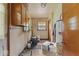 View of utility room with cabinets, window, and water heater at 2840 W 12Th St, Anderson, IN 46011