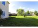 Large backyard with green lawn and mature trees, perfect for outdoor activities at 3059 Black Forest Ln, Indianapolis, IN 46239