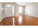 Bright living room features wood floors, neutral paint and a large front door at 3059 Black Forest Ln, Indianapolis, IN 46239