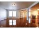 Open-concept living and dining room with wood floors and neutral paint at 3059 Black Forest Ln, Indianapolis, IN 46239