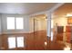 Open-concept living and dining room with wood floors and neutral paint at 3059 Black Forest Ln, Indianapolis, IN 46239