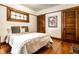 Bedroom featuring hardwood floors, decorative window, and white walls at 309 N Riley Ave, Indianapolis, IN 46201