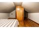 Bedroom featuring hardwood floors and a spacious closet at 309 N Riley Ave, Indianapolis, IN 46201
