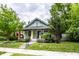 Quaint bungalow with a well-kept yard and cozy front entry at 309 N Riley Ave, Indianapolis, IN 46201