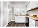 Well-lit kitchen showcases white cabinets, wood countertops, and a stainless steel sink at 309 N Riley Ave, Indianapolis, IN 46201