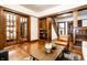 Spacious living area with wood floors, french doors, and natural light at 309 N Riley Ave, Indianapolis, IN 46201