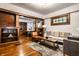 Elegant living space featuring hardwood floors, rich wood trim, and abundant natural light at 309 N Riley Ave, Indianapolis, IN 46201