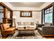 Cozy living room showcasing hardwood floors, wood trim, and a stylish seating arrangement at 309 N Riley Ave, Indianapolis, IN 46201