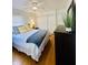Comfortable bedroom with hardwood floors and white walls and ceiling fan at 3414 Rost Dr, Columbus, IN 47203