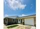 Attractive ranch-style home features stone accents, a garage, and a well-maintained lawn at 3414 Rost Dr, Columbus, IN 47203
