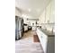 Bright kitchen with white cabinets, granite countertops, stainless steel appliances, and hard surface floors at 3414 Rost Dr, Columbus, IN 47203