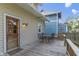 Cozy outdoor back deck with a dining set, perfect for enjoying meals and outdoor relaxation at 344 N Whittier Pl, Indianapolis, IN 46219