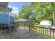 Outdoor deck overlooking the beautiful fenced backyard with a garden, perfect for entertainment at 344 N Whittier Pl, Indianapolis, IN 46219
