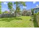 Enjoy the backyard's ample greenery with a cozy fire pit and seating area for outdoor gatherings at 344 N Whittier Pl, Indianapolis, IN 46219