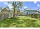 Beautiful backyard with seating, a well-kept lawn, and mature trees, perfect for outdoor enjoyment at 344 N Whittier Pl, Indianapolis, IN 46219