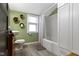 Well-lit bathroom featuring a shower-tub combination and stylish fixtures with a minimalist design at 344 N Whittier Pl, Indianapolis, IN 46219