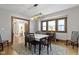 Inviting dining room with hardwood floors, a decorative rug, and natural light, perfect for Gathering gatherings at 344 N Whittier Pl, Indianapolis, IN 46219