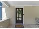Inviting covered front porch with decorative wreath, and cozy welcome mat at 344 N Whittier Pl, Indianapolis, IN 46219