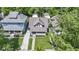 Inviting home with a charming facade, lush lawn, and mature trees at 344 N Whittier Pl, Indianapolis, IN 46219