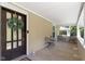 Charming front porch featuring a welcoming door, decorative wreath and seating at 344 N Whittier Pl, Indianapolis, IN 46219