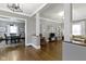 Spacious living room with hardwood floors, neutral colors, and open access to dining area at 344 N Whittier Pl, Indianapolis, IN 46219