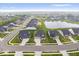 Aerial shot of a suburban neighborhood featuring well-manicured lawns, a pond, and modern home exteriors at 3463 Sunnyvale Dr, Brownsburg, IN 46112
