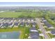 An aerial view showing modern homes in a suburban neighborhood with lush green spaces and trees at 3463 Sunnyvale Dr, Brownsburg, IN 46112