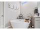 Elegant bathroom highlighting a contemporary freestanding tub and modern fixtures at 3463 Sunnyvale Dr, Brownsburg, IN 46112