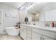 Well-lit bathroom showcasing a modern tub, double vanity, and stylish shower at 3463 Sunnyvale Dr, Brownsburg, IN 46112