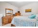 Cozy bedroom featuring light wood furniture and vibrant artwork at 3463 Sunnyvale Dr, Brownsburg, IN 46112