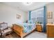 Inviting bedroom featuring wood floors, quaint furniture, and a large window at 3463 Sunnyvale Dr, Brownsburg, IN 46112