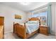 Charming bedroom with a light wood bed frame and natural light from the window at 3463 Sunnyvale Dr, Brownsburg, IN 46112