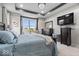 Comfortable bedroom featuring a tray ceiling, stylish chandelier, and a scenic outdoor view at 3463 Sunnyvale Dr, Brownsburg, IN 46112